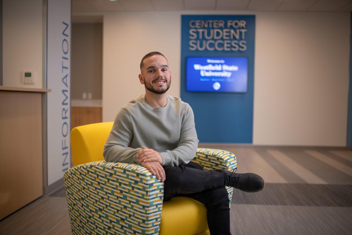 Reading Specialist student smiling outside the Center for Student Success office.