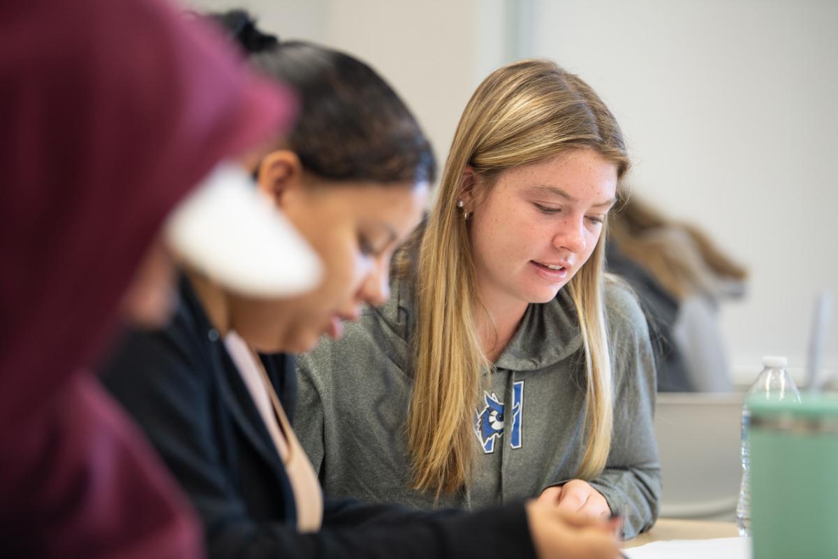 Two students working on a classroom assignment together.