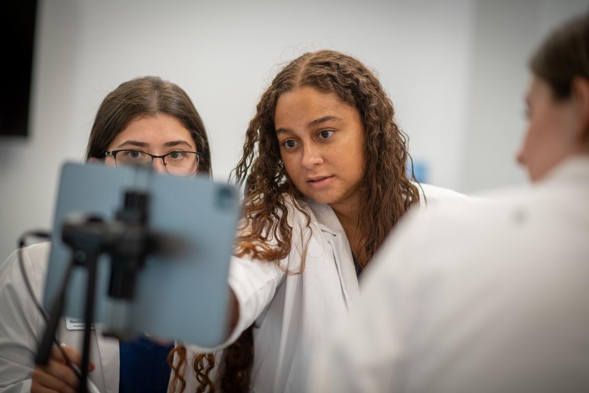 Health sciences students participating in a hands-on clinical workshop.