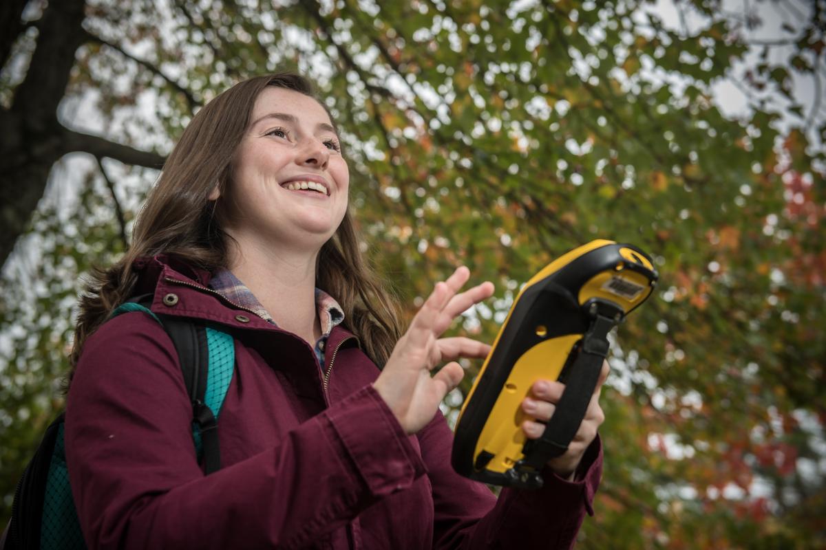 Urban and Regional Planning student doing fieldwork smiling.