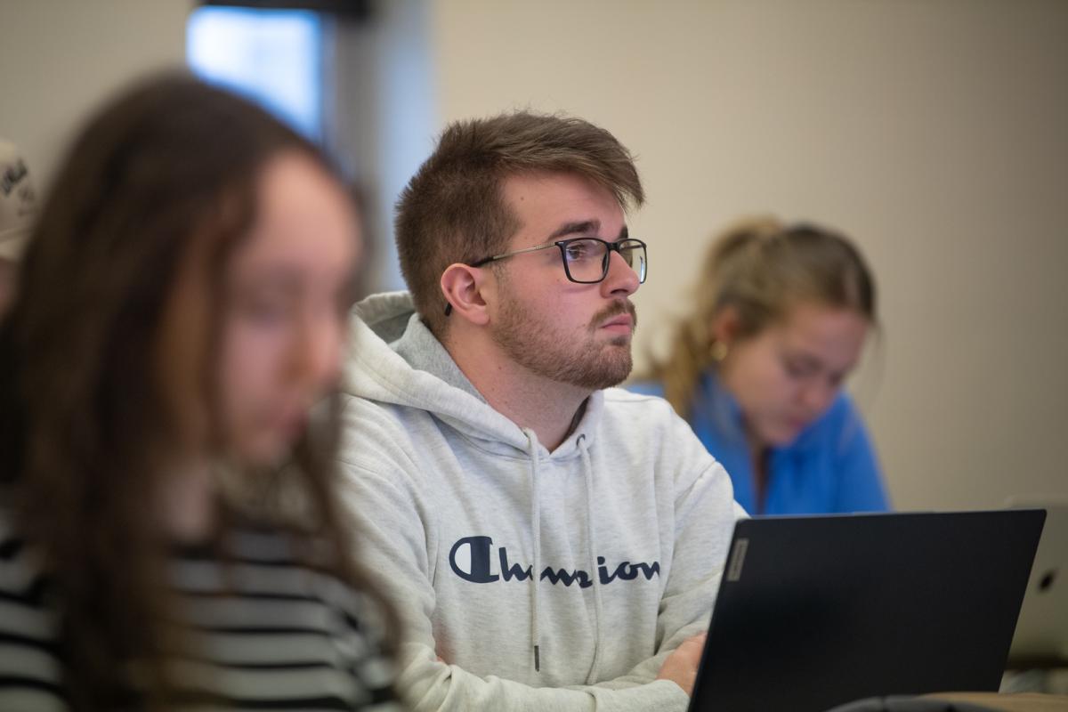 Student listening attentively in an accounting class.