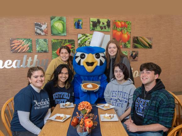 Nestor serves up some pumpkin pie to students for Thanksgiving in the Dining Commons
