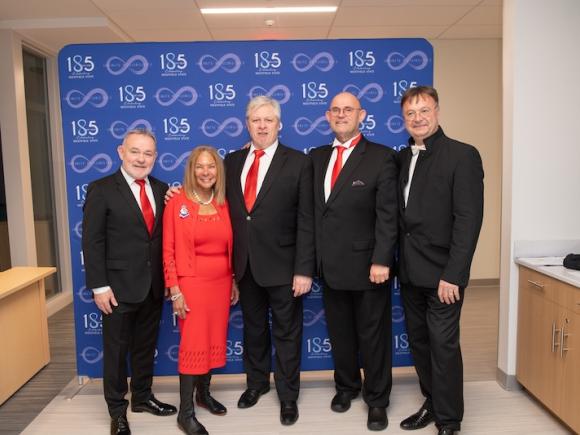 President Thompson smiling with The Irish Tenors.