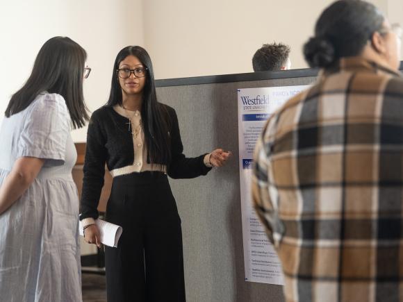 Student delivering a presentation at the Honors Presentations & Awards Ceremony.