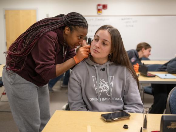 Students in the Medical Aspects of Physical Activity class learn to use an otoscope and opthalmoscope. 