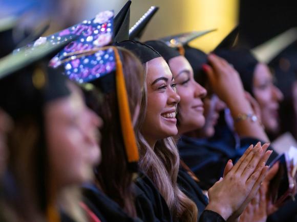 Graduates look to stage and applaud