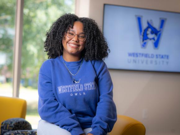 Social work student smiling wearing a WSU sweatshirt.