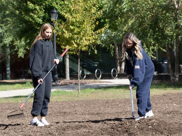 Students plant a meadow outside Nettie Stevens Science Center