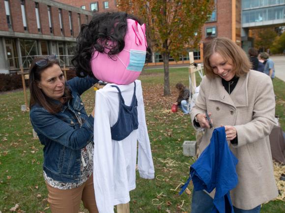 staff build a scarecrow
