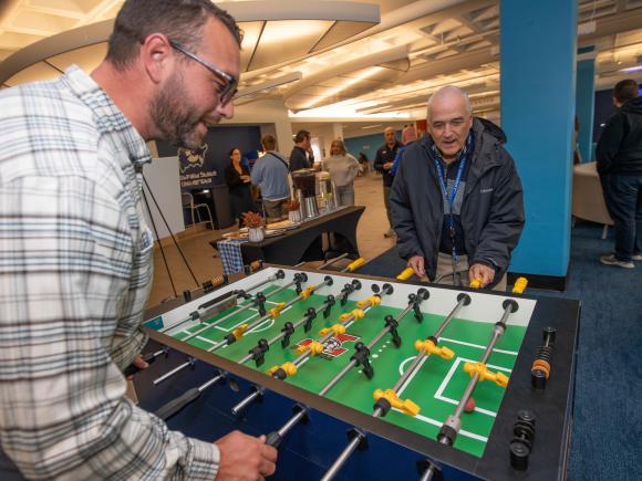 staff enjoy foosball