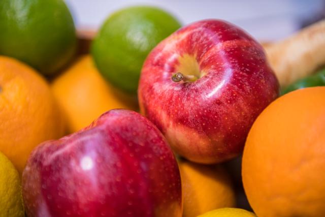 Vibrant apples, oranges, and limes.