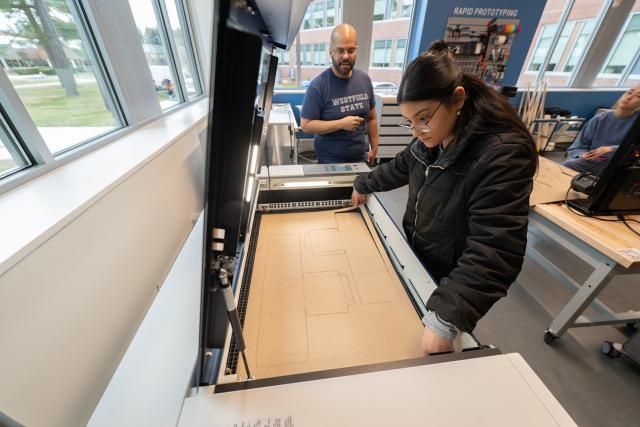 Student working with a professor in the RIDE Center.