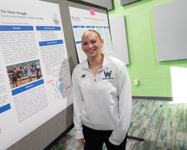 Student presenting research on the impact of preventative care at the Undergraduate Research Conference.