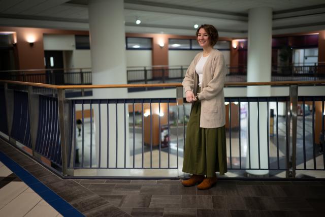 Student smiling at her internship with the MA State Police.