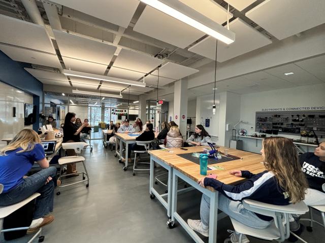 Interior image of the RIDE Center showcasing students working on a classroom project.