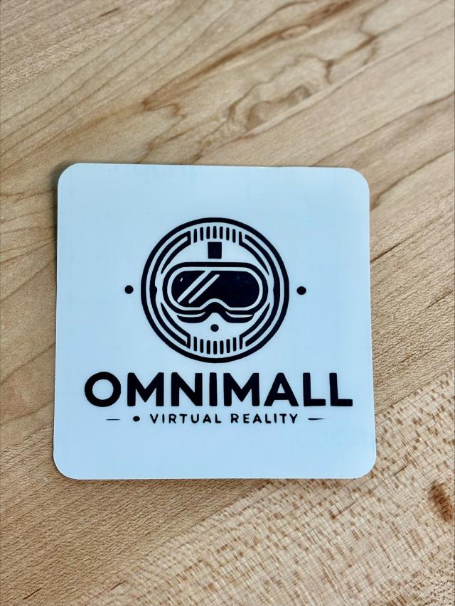 sticker labeled "omniball: a virtual reality"; white background, logo with a pair of virtual reality goggles