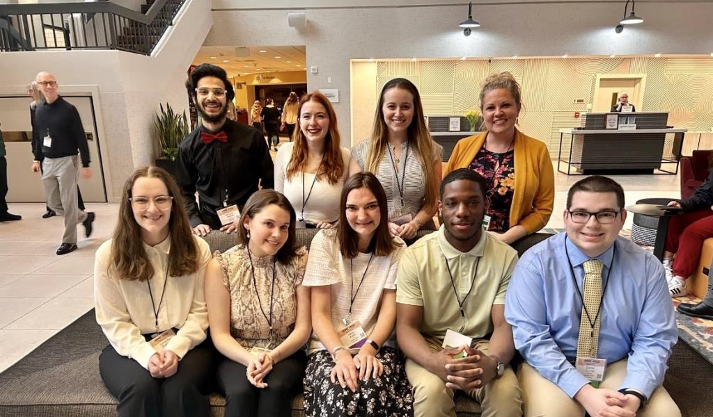 Honors Program group photo including students and a faculty member smiling in rows.