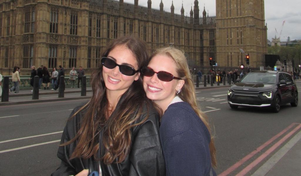 Two students studying abroad pose in front of Big Ben in London.