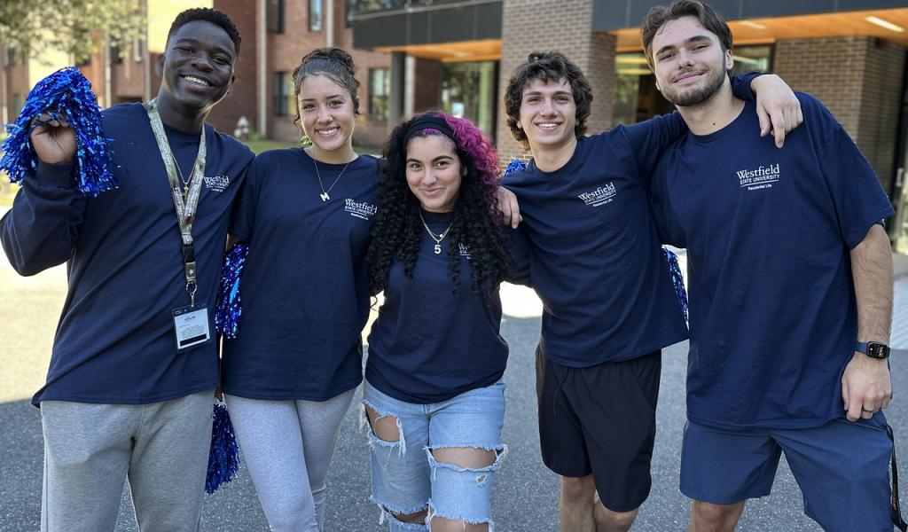 Residential Life student staff smiling together in a group on Move-in Day.