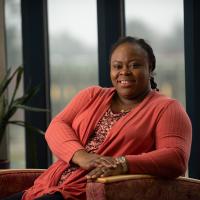 ABA student smiling in campus library