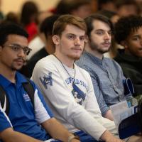 Students at New Student Orientation listening to a speaker.