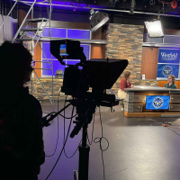 A student in the TV Club directing Club Connections, a student-run TV show that highlights clubs around campus.